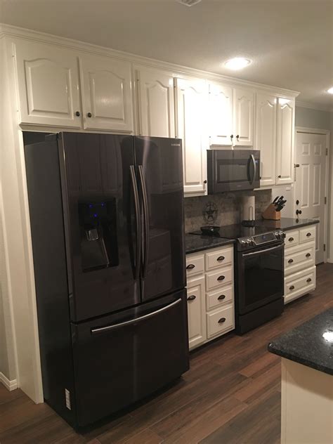 white cabinets with black stainless steel appliances|mixing white and stainless appliances.